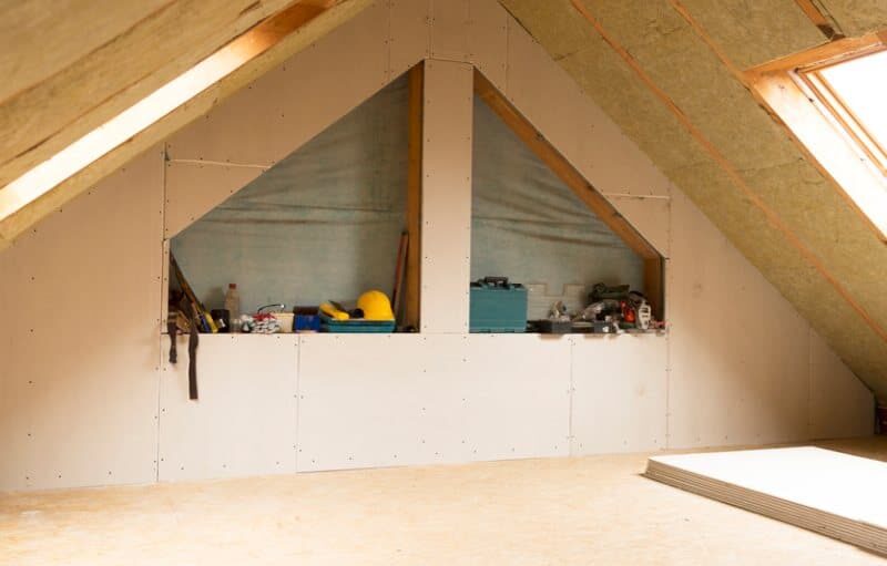 house attic under construction mansard wall insulation with rock wool