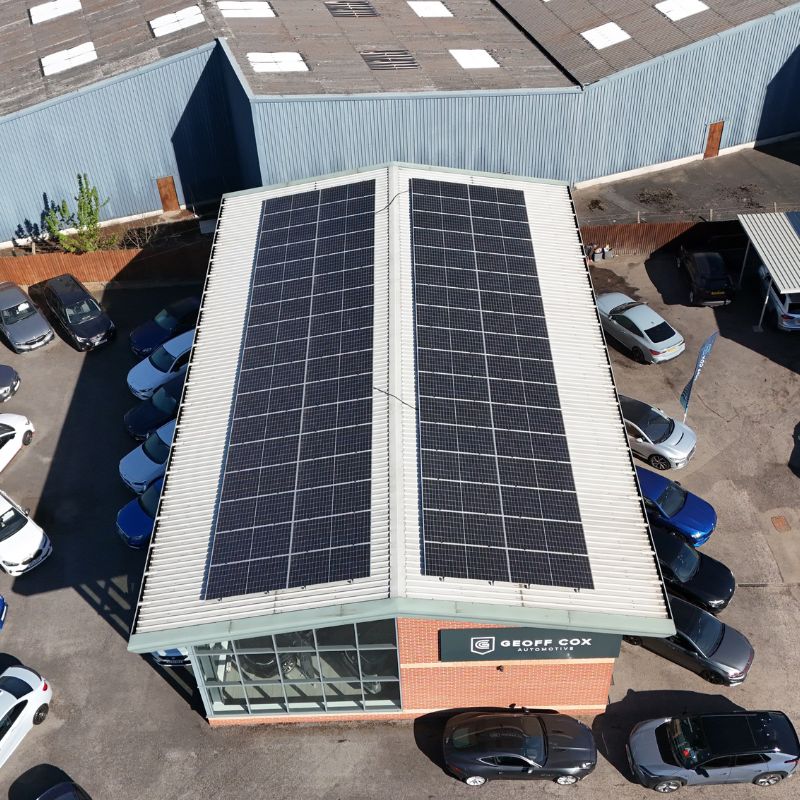 roof with commercial solar panels on car dealership geoff cox